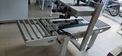 Máy dán băng keo thùng carton, máy dán thùng mặt trên mặt dưới, máy dán thùng bán tự động 