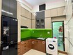 Mẫu Tủ Bếp Chữ L Phối Acrylic Và Vân Gỗ Hiện Đại 