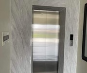 Bán nhà phùng chí kiên,thang máy,ôtô tải đỗ cửa vào nhà, 42m2x7 tầng, giá 9.4 tỷ