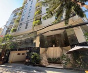 Tòa Apartment Lô Góc Hoàng Cầu Ô TÔ Dừng Đỗ 9 Tầng 64 Tỷ 2 Mặt Tiền Vỉa Hè