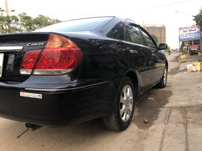 Cần bán gấp toyota CAMRY 2.4 màu đen sx 2005 số sàn 9