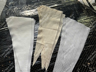 CẮT ĐỤC LỖ VẢI ÁO KHOÁC,đục lỗ vải theo yêu cầu 12