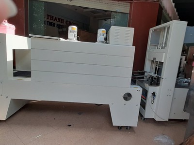 Máy cắt dán và rút màng co PE cho lốc chai- lon, máy màng co PE bán tự động 1