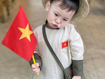 Áo dài thêu cờ   Biểu tượng của lòng tự hào dân tộc và vẻ đẹp Việt 0
