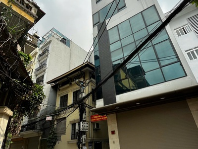 Mặt phố đông quan phùng chí kiên - ô tô tránh - tòa nhà 7 tầng thang máy, lô góc - 55m chỉ 25 tỷ 0