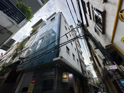 Tin thật 100  bán tòa vp lô góc 105m2 x 8t tại thái hà - đường ô tô tránh - dòng tiền 1,3 tỷ/năm 0