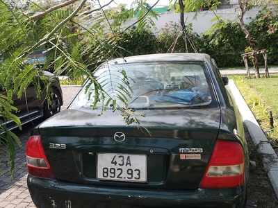 Cần bán xe mazda 2002 1